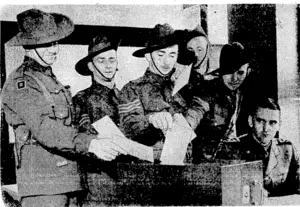 Central Press Photo. Australian soldiers, now serving in England, recording their potes in London at the recent* Federal election. A special Act was passed at Canberra to enable them to vote while overseas. (Evening Post, 26 November 1940)
