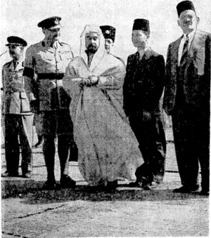 Official War Photo. Major-General B. C. Freyberg, V.C. (left) with the Emir of Transjordania, watching New Zealand troops in the Western Desert. On the extreme left is General Sir Archibald JVavell, Commander-in- Chief of British troops in the Middle East. (Evening Post, 17 December 1940)