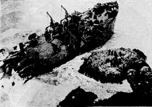 American landing craft No. 349, conveying German prisoners of war from the Anzio bridgehead to Naples, ivas thrashed to pieces at daybreak recently on an island off the coast of Italy. Some of the prisdners and ship's officers are seen on the rock in the right foreground.,. A number of these men were later swept off by the waves and drpivned. (Evening Post, 15 May 1944)