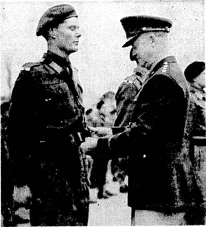 General Eisenhower decorating Cadet Officer J. G. H.- Wadsworth with the Belt of Honour as the best cadet of the year at Sandhurst. (Evening Post, 18 May 1944)