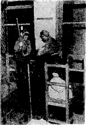 Girls making one of the big "block busters" which are doing much damage in Germany. They are seen at a Royal Ordnance factory in England adding high-explosive "biscuit" to molten high explosive previously poured into the bombcasing. (Evening Post, 18 May 1944)