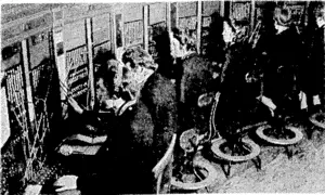 Switchboard operators at work at the Regional Fire Control Room, Battle Headquarters of the National Fire Service' in London. This switchboard is the nerve centre through which the operations officer receives reports of fires and the progress of enemy Mir raids over the city, and issues his orders. (Evening Post, 27 May 1944)