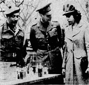 The King explaining a point of interest to Princess Elizabeth during their visit last month to the Royal Army* Medical Corps. The Queen was also one of the party. It ivas the first time the Princess had made a full-length lour with her parents. Scottish troops, armoured infantry, and medical units were amongst those inspected. (Evening Post, 29 May 1944)