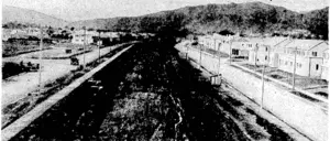Extension of the raihuay line past Waterloo to serve the large new housing areas in the Hutt Valley, Looking towards Na enae, where formation and ballasting ivork is proceeding. . (Evening Post, 30 June 1944)