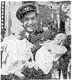 Flying Officer A. J. Moller, of Haioera, who received the D.F.M. at a recent investiture, proudly presents his twin boys, John and Anthony, as he leaves Buckingham Palace. (Evening Post, 05 July 1944)