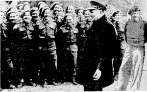 Mr. Churchill raises a laugh from troops he addressed at Caen. These men led the D Day assault, and were complimented by him on their work. General Montgomery is on the right. (Evening Post, 29 July 1944)