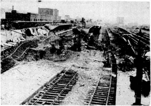 Bomb-blasted signal box and damaged permanent way at Caen before a railway construction company of the Royal Engineers had repaired the damage. (Evening Post, 20 September 1944)