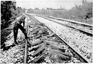 A section of the main railway line in the Teano Valley destroyed by the retreating enemy. This shows the latest German method of demolition in Italy. (Evening Post, 04 January 1944)