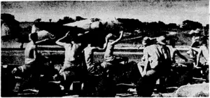 A Ventura bomber leaving a RN.Z.A.F. forward Pacific aerodrome to attack the Japanese forces in the Bougainville area. Armourers seated on bombs in the foreground wave their farewells as the Ventura V pulls out. (Evening Post, 06 January 1944)