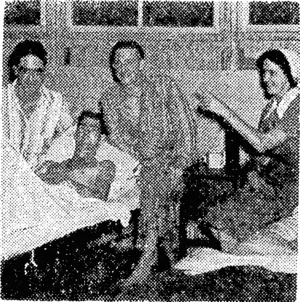 Sister C. M. Kelland (Wellington) and patients in the 4th New Zealand General Hospital in the Pacific. The patients, from the left, are Able Seaman J. Power (Auckland), Private L. J. Briscoe (Kaponga), and Gunner J. P. Fitzgerald (Wellington). (Evening Post, 20 January 1944)