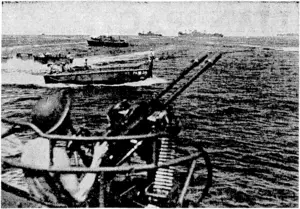 American landing craft, ivith supplies for the U.S. marines on Bougainville Island, move in at Empress Augusta Bay. In the background are transports filled with men and supplies. (Evening Post, 22 January 1944)