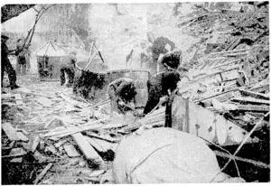 London is strongly protected from air attack in these days, but some enemy bombers get through the defences. A.R.P. men are seen searching the ruins of a building for buried people after one of these nuisance raids. (Evening Post, 26 January 1944)