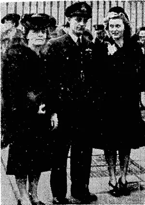 A fighter pilot, Wing Commander Colin Gray, D.5.0., of the R.N.Z.A.F., after being decorated at Buckingham Palace. With him are Mrs. and Miss Montgomery. (Evening Post, 27 January 1944)