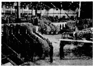 New types of Spitfires are in production, but so far no details have been released for publication. Here is a collection of wing sections in an assembly shop. (Evening Post, 29 January 1944)