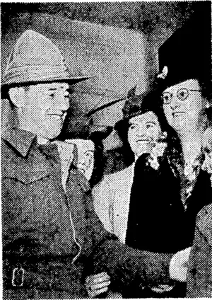 Back home, and very welcome. A scene at the clearing station when a draft returned from overseas. (Evening Post, 03 February 1944)