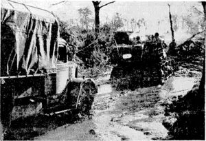 Transport has been very difficult in the Italian battle areas in recent weeks. Here is a bulldozer pulling a Fifth Army lorry out of the mud. (Evening Post, 09 February 1944)