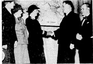 The Minister of Defence (Mr. Jones) being greeted by Miss Iris Crooke, Director-General of Voluntary Aids in New Zealand, at the parade of V.A.D.s on Thursday evening. On Miss Crooke's right are Mrs. 0. B. Hole, Commandant of the Women's Transport Section, and Miss D. Cooper, Wellington Centre Commandant. On the right is Mr. C. H. Chapman, M.P., chairman of the Wellington Centre. (Evening Post, 12 February 1944)