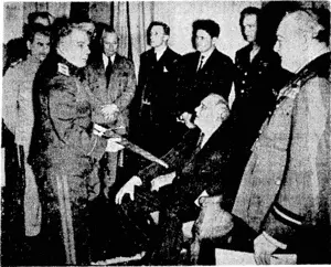 During the Teheran conference Mr. Churchill presented the Stalingrad Sword to Marshal Stalin. Marshal Voroshilov shows the sword to President Roosevelt. On the extreme right is Mr. Churchill. (Evening Post, 29 February 1944)