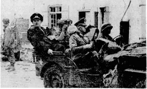 When the German commander, yon Aulock, the "mad colonel" came out to surrender Brestj an R.A.F. photographer was there to take the first photographs. After his surrender Colonel yon Aulock is driven off in a jeep, with other high-ranking German officers and their baggage in the back seat. (Evening Post, 03 October 1944)