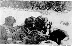 British paratroopers of the Border Regiment waiting under cover of a hedge to repulse Germans who were advancing only about a hundred yards away. (Evening Post, 06 October 1944)