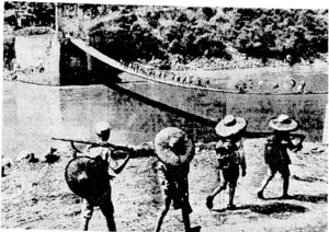 Chmese soldiers crossing the Sahoeen River, in Burma. Carrying tools and weapons, they are seen crossing a primitive suspension bridge replacing the bridge which was blown up two years ago to check the Japanese advance. (Evening Post, 04 November 1944)