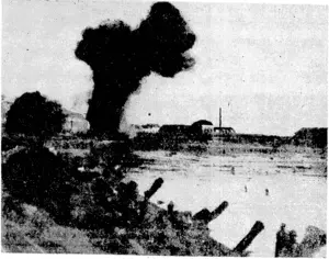 British Official Photograph, VIA BEAM WIRELESS. British troops advancing along the waterfront near Flushing, with shells bursting ahead of them, during the British landings on Walcheren Island in the early hours of November 1. (Evening Post, 10 November 1944)
