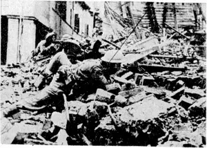 Greek Bren gunners and riflemen give covering fire from rubble-strewn positions as the Adriatic coast town of Kimmi was captured by the Allies after being stubbornly defended by the Nazi enemy. (Evening Post, 11 November 1944)
