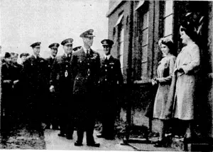 The Kiyg, accompanied by the Queen and Princess Elizabeth, recently visited several stations of the Koyal Canadian Bomber Group in England to make presentations of awards to officers and men and to congratulate air crews and ground staff on the excellent record they had established during many bombing trips over Germany and occupied Europe. The Queen and Princess Elizabeth are seen posing for Canadian airmen to take snaps, tvhilst his Majesty looks on. (Evening Post, 11 November 1944)