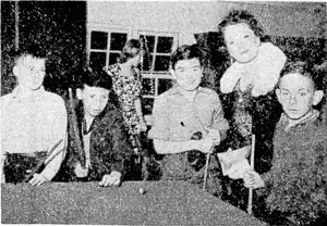 Lady Neivall accompanied his Excellency the Governor-General on Thursday evening., when he inspected the activities of the Wellington Boys' Institute. She is seen watching a game of "bobs." (Evening Post, 18 November 1944)
