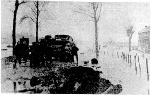 TJ /} J*j z. British Official Photo, VIA BEAM WIRELESS lite flooded banks of the River Maas, near Maeseyck Maintenance crews of the Royal Engineers continue to carry out their duties despite the trying conditions. (Evening Post, 05 December 1944)