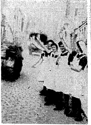 Dutch nurses cheer a British armoured column passing through Eindhoven. (Evening Post, 05 December 1944)