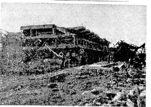 Bomb-shattered warehouses on the waterfront at Boulogne^ after Allied air raids and demolition by the Germans. (Evening Post, 13 December 1944)