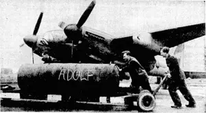 Loading a 40001b bomb on to a Mosquito bomber, en route to Berlin, (Evening Post, 12 February 1945)