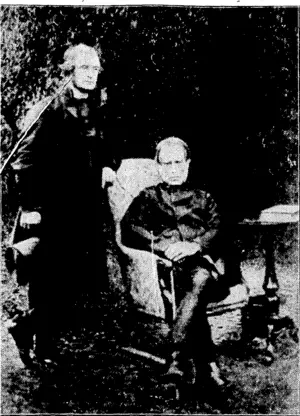 Bishop George Augustus Selwyn (standing) and Sir WiHiam Martin (Chief Justice) seated, who were associated in framing the Constitution of the Church of England in New Zealand. This work is referred to in Mrs. Sel, ..: --.-■'■ wyn's autobiography (Evening Post, 04 August 1928)