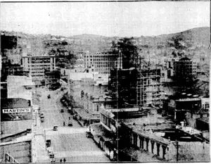Evening Post" The NEW BUILDING FOR THE WELLINGTON GAS CO.—Looking along Courtenay Place towards the city, showing on the right; the new ■building which is at present being constructed for the Wellington Gas Co. at .the back of their present buildings In the distance can be .. \ seen several of the tall buildings ivhich have become such afeature of the cuy during recent years. : (Evening Post, 21 May 1930)