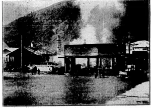 Erenlns^Post" Kioto, AFTER'THE/BIG:FIRE AT EASTBOURNE.—In-jihe^earlf hours of this morning a. fire- broke'ou6^m< the general store'OfjMrJTJJJGosson, on Marine Para^,opposite the Rona Bay Wharf. The -photograph ! showi;tHe.scene;of'destruction,.^ houses'being[bfirnt., , . (Evening Post, 13 August 1930)