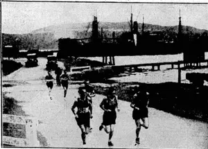 E. T. Robson Photo. rRAGEFORTHEBENNETTnMEMORIAL SHIELD-TAe leaders crossing.the Patent Slip at Evans Bay during the running of the Bennett Memorial road race on Saturday afternoon. In front, from left, are Lr. Grosser, who finished second, A. L. Stevens, the winner, and L. A. Sinclair third. A. Carter is ' ' behind them. (Evening Post, 28 September 1931)