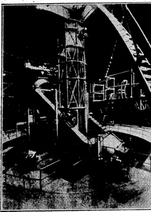 MEASUEING THE TEMPERATURES OP THE STARS.—The 100 in telescopp of the Mount Wilson Observatory with the thermocouple attachment used for measuring tho temperature of the stars and planets in place near the top of tho huge instrument. Tho photograph is supplied by the Carnegie Institution pf Washington, U.S.A. (Evening Post, 14 September 1934)