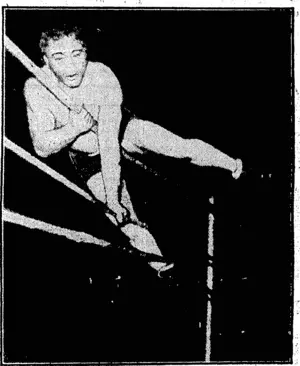 FLYING TACKLE ARTIST.—Though Gus Sonnenberg was scarcely as spectacular on Wednesday night as had been expected, he is a highly colourful wrestler, and, when his flying tackles miss the mark he sometimes finishes up in awkward positions. He is shown"here' saving himself from hurtling out of thejing. (Evening Post, 22 September 1934)