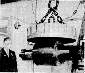 MODERN MAGIC.—This magnet—one of the wonders of'the heavy section, of the British Industries Fair at Castle Bromwich, ■ Birmingham—has a diameter of 76 inches, and can'lift no less than'46'torn* (Evening Post, 28 April 1936)