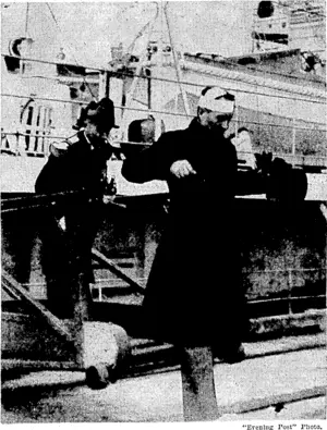 While acknowledging the salute as he boarded the Rigault de Genouilly at Auckland yesterday morning, the French Consul, M. Edouard Joubert, had the misfortune to strike his head, and ivas severely cut. fie is seen leaving the warship with the captain, Commander; Moron, after, having had his wounds dressed. (Evening Post, 27 April 1937)