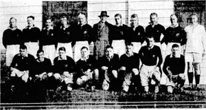 C. B. Fitzgerald Photo. Wellingtons representative Rugby team, which recently defeated TaranaH at Hawcra. Back row, from left, J. Wells, N. W. Devine, A. H. Andrews, C. Pringle, Fl C. Guy, Major T. I. King, manager, N. Burns, A. Lambourn, F. C. Leahy, H, L. Baldwin, and S. T. Hunt, referee Front row, R. Ongley,H. R. Pollock, captain, B. S. Sadler, J. Wareham, R. C. Veitch, C. M. Le Quesne, C. Hudson, and G. Wales. (Evening Post, 05 June 1937)