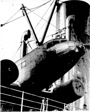Erening Post". Photo. The fuselage-of the big Douglas.airliner which -is being'carried ■as deck cargo on the U.S.S.Co.'s motor-ship Limerick towers^above.the ship's rails. It'is on its, way from San Franciscoto Melbourne, and . is to bemused in the Vie toria-Tasmania air service. ,■■■■■ (Evening Post, 07 June 1937)