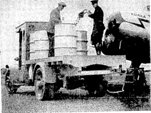 Evening P03I" Photo. Fuelling up, a scene at Milson Aerodrome, Palmerston. North, us the Union Airways monoplane Kuaka ivas receiving supplies. (Evening Post, 14 June 1937)