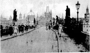 Looking: across the. Charles .Bridge, linking the new.and old ■fseen.in« background) ■ parts of Prague, capital city, of\ Czechoslovakia.-, Afirst-class sensation: has ' been > created throughout Europe •» by nhediscovery' of.-an 'alleged -•.plot to assassinate: the;French\ ; Foreign Minister,''M.'Delbos, when visiting Prague. . (Evening Post, 13 December 1937)