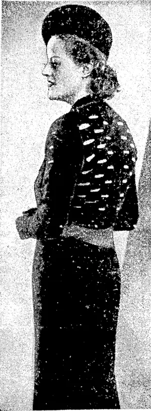 Sport and General" Photo. Charming black ivoollen dress with novel cut-out effect on bodice, and stitched satin belt. A "high" hat in black felt is worn to match." (Evening Post, 18 December 1937)
