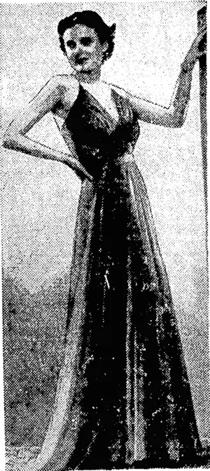 Sport and General" Photo. Delightful evening gown in dovegrey chiffon, with a draped front and a Grecian bust-line. (Evening Post, 26 March 1938)