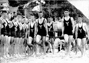 Evening Post" Photo. The inauguration of the V.M.C.A. Swimming and Life-saving Club took place at Oriental Bay last Saturday with a special gala day. One of the teams, with reel, is seen marching into position. (Evening Post, 26 March 1938)