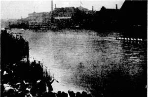 Sport and General" Photo. The finish of the University boat race on k April 1- over the Putney-Mprtlakecourse onihe'Thames. The Cambridge boat'is seen finishing .first, ivitH. Oxford several lengths behind. ■ . (Evening Post, 21 April 1939)
