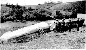 Neville. Ross Photo. \The 136 ft Centennial war canoe under construction at historic Kerikeri, Bay of Islands. When completed the canoe will be made up * #1 $liree sections, interlocked by their own weight. Each end section will measure 33[t and the middle section 70jt. (Evening Post, 06 May 1939)